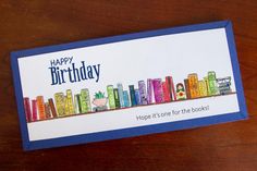 a birthday card with colorful books on it