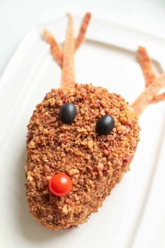 a close up of a plate of food with carrots and reindeer antlers on it