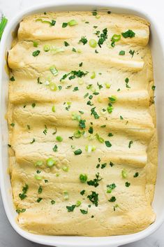 a casserole dish filled with green vegetables