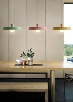 a dining room table with some plants on it