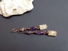 Raw stone earrings. Genuine Citrine, Amethyst and Labradorite earrings. Rustic earrings. Copper earrings. Colorful earring. Gemstone earrings. Everyday earrings. Wire wrapped earrings. Bohemian earrings. artisan earrings. ● Materials: Natural stone, Copper ● Measures: - Length- about 2.18 inches (5.5 cm) x 0.31 inches (0.8 cm) wide. All my jewelry is my own original design and handcrafted by me. The color and brightness of the product in the photograph depending on the settings of your monitor. Wire Wrapped Fusion Earrings For Gift, Fusion Style Wire Wrapped Earrings For Gift, Artisan Hand Wrapped Earrings As Gift, Artisan Hand Wrapped Earrings For Gift, Raw Stone Earring, Rustic Earrings, Earrings Wire, Earrings Colorful, Labradorite Earrings