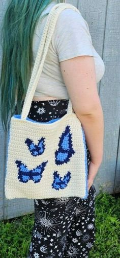 Tapestry style bag with blue butterflies and lining! The bag is about 11 inches in length and 10.5 inches in height and has 4 butterflies on the front side while the back is in a solid light blue that is the same shade as seen in the butterflies.   The bag is lined with a solid light blue fabric. Rectangular Travel Bag With Butterfly Print, Everyday Butterfly Print Tote Bag, Handmade Blue School Bag, Butterfly Bag, Light Blue Fabric, Butterfly Bags, Blue Butterflies, Blue Butterfly, Blue Fabric