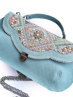 Light blue Leather purse with bohemian embroidery , colorful handbag , sky blue women's cross body purse, Unique gift for her This lovely one of a kind purse is handmade from fine leather combined with a colorful embroidery fabric. Very unique and elegant, and perfect for a spring day out:) it has a zipper pocket in the back.  The measurements for the purse are 12.5 inch wide (at the widest  part) and 7 inch high it has a 50 inch chain which is removable, thus can be worn across the body, or opt Bohemian Embroidery, Green Leather Handbag, Colorful Handbags, Green Handbag, Printed Handbags, Cross Body Purse, Unique Gifts For Her, Gorgeous Bags, Printed Bags