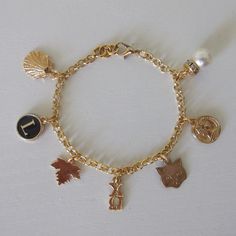 Customize your own gold charm bracelet! Made with 24k gold plated charms and chain. Select your chain and however many charms (see third photo). Just message me to purchase and I'll create a seperate listing. Gold Jewelry With Lobster Clasp For Friendship, Gold Charm Bracelet With Removable Dangle Charms, Gold Charm Necklace For Friendship, Gold Hypoallergenic Charm Bracelet For Friendship, Hypoallergenic Gold Charm Bracelet For Friendship, Hypoallergenic Gold Dangle Bracelets, Gold Charm Bracelet With Removable Charms For Gift, Gold Charm Bracelet With Removable Charms As Gift, Gold Metal Charm Bracelet For Friendship