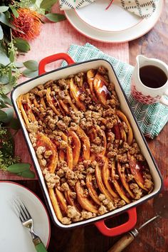 a casserole dish filled with sliced peaches and oatmeal