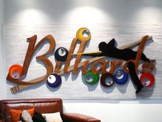 there is a sign on the wall that says billiard's with an image of a cat