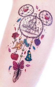 a tattoo with an image of a castle and some birds on it's side