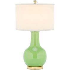 a green table lamp with a white shade