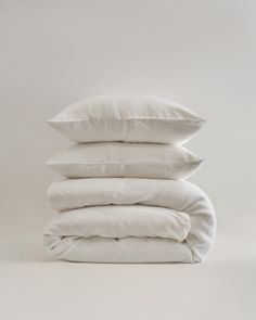 four pillows stacked on top of each other