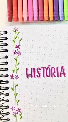 an open notebook with colored markers and writing on it that says, history written in pink