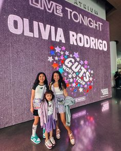 We had the best time ever at the girls’ first concert! 💜Olivia Rodrigo totally rocked it, and now I’ve got two little concert junkies begging to see every one of their favorite artists live. My sister and I were reminiscing about our first concert (shoutout to @tiffany_tunes! IYKYK), and I still cherish those memories with my mom and sister. And now getting to experience my girls’ first concert with my sister made it such a special night! I custom made Edie’s shirt and our bags with my @cri... Concert Olivia Rodrigo, Shout Out