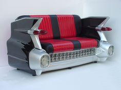 a black and red chair sitting on top of a white floor