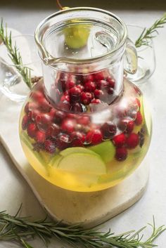 Get ready to make your holiday gatherings memorable with our easy Christmas Sangria! This white wine cocktail is packed with the merry flavors of cranberries, apple and pear, a splash of ginger beer, and star anise. It’s absolutely perfect for entertaining a crowd. Just mix up a large batch of this delicious sangria and watch as your guests enjoy each festive sip .Grab your pitchers and get ready for toasts all around! #ChristmasSangria #HolidayCheers #FestiveDrinks Cranberry Sangria, Christmas Cocktails Easy, Easy Main Dishes