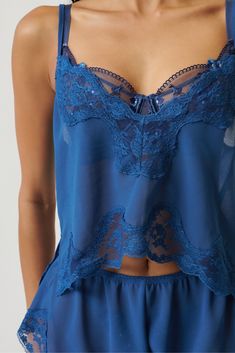 The perfect addition to your sleepwear collection, the Harley Pyjama Set in Cobalt is crafted from a luxurious fabrication that is both soft and sophisticated. Vintage-inspired lace details add to the timeless sleepwear look. Layer this set over your Kat the Label lingerie. My fabrics are very delicate, please handle with care. High-cut shorts and camisole style top Cold hand wash only Dry flat in shade Store me in my care bag 100% Polyester Kat The Label, Vintage Pyjamas, Pyjama Outfit, Summer Pjs, Cut Shorts, Lace Sleepwear, Shade Store