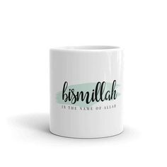 a white coffee mug with the name bushmillah in green ink