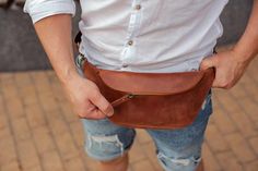 Leather fanny pack for men and women is our new item. We have made it in two colours- brown and white. As for me, it is very comfortable leather bag for any occasion. Just take it and forget. You can put inside your phone,  passport and other necessary things. DESCRIPTION- zipper closure- regulated strap- one pocket outsideDimensionsLength - 20 cm/7.9 inchHeight - 11 cm/4.33 inchDepth - 6 cm/2.4 inch Casual Belt Bag With Pockets For Everyday Carry, Casual Everyday Carry Belt Bag With Pockets, Business Travel Bag, Leather Weekender Bag, Laptop Bag For Women, Leather Fanny Pack, Brown Shoulder Bag, Festival Bag, Leather Belt Bag