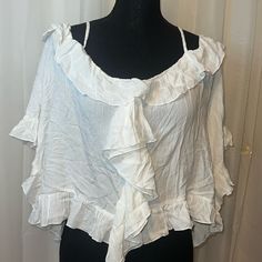 Elan White Ruffle Domen Sleeve Crop Top New Never Been Worn Size Is One Size Fits Most I Think S-L Spring Beach Tops With Ruffles, Spring Beach Ruffle Tops, Spring Beach Ruffled Tops, Feminine Ruffled Tops For Vacation, White Ruffle Sleeve Blouse For Summer, Feminine Ruffled Blouse For Vacation, White Bohemian Top With Ruffles, Flowy Ruffle Sleeve Tops For Beach, Beach Ruffle Sleeve Tops With Ruffles