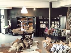 a room filled with lots of different types of food in baskets on top of tables