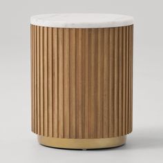 a wooden stool with white marble top