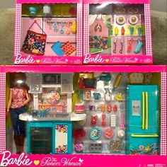 two barbie doll houses with kitchen furniture and accessories in pink boxes on top of each other