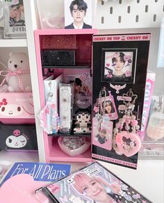 there is a pink shelf with many items in it