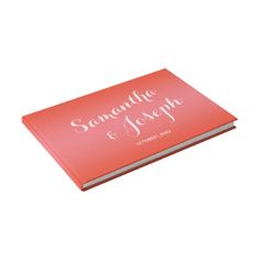 an orange coral colored wedding album with the words san francisco and joseph on it's cover