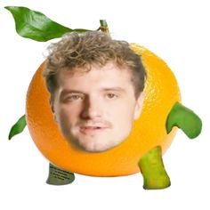 an orange with a man's face and green leaves on the top of it