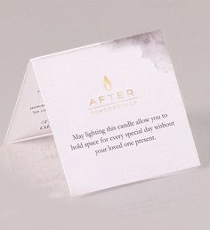 a close up of a piece of paper with a business card on top of it