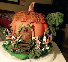 a cake made to look like a fairy house