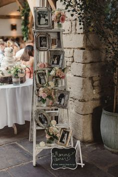 an old ladder is used as a wedding display