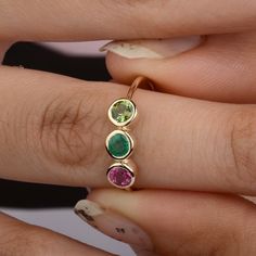 Multi Stone Ring / Trio Birthstone Ring / Three Stone Ring / Dainty Ring / Three Stone Bezel Setting Band / Wedding Ring / Personalized Ring. Features * Items Code: SGR01390 * Metal: 14K Solid Gold (18K also available - Additional fees may apply) * Solid 14K Yellow Gold with stamped * More options in gold color: Rose gold, yellow gold, White gold * Multi Gemstone Wt: 0.85 ct. (Pink & Green Tourmaline, Emerald) * Gemstone Size: 3.5 mm (Personalized gemstone available, contact us for custom order) Band Wedding Ring, Ring Three Stone, Multi Gemstone Ring, Colored Engagement Rings, Zierlicher Ring, Personalized Ring, Three Stone Ring, Personalized Rings, Ring Dainty