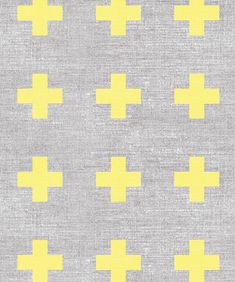 a gray and yellow fabric with crosses on it