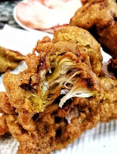 some fried food is on a white plate