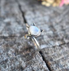 Cat Ring Details:-Choice of Natural Rainbow Moonstone, Dominican Larimar, or Natural Amethyst- 12mm face height- 2mm smooth round band- .925 solid sterling silver- Available in US ring sizes 4-10.5 with 1/2 sizes. 💜Connect with us on Instagram @a_wild_violet for sales and giveaways!**All items are in stock and ship within 2-5 business days from received payment (excluding Saturday/Sunday) from the US. If you are within the US please expect 3-7 business days for shipping transit and delivery. In Adjustable Spiritual Moonstone Ring, Adjustable Moonstone Jewelry With Round Stone, Mystical Round Moonstone Jewelry, Adjustable Moonstone Birthstone Ring, Mystical Round Natural Stones Jewelry, Mystical Round Natural Stone Jewelry, Mystical Style Moonstone Ring With Natural Stones, Spiritual Nickel-free Moonstone Ring, Nickel Free Round Spiritual Moonstone Ring