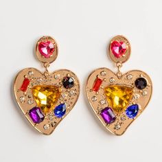 The 80's are back with the Burnout Earrings by Petite Moments! Colorful cubic zirconia stones are set in yellow gold plated heart earrings for the perfect bold, statement earrings. Shop more fun and bold earrings at Local Eclectic. Trendy Gold Heart Earrings For Party, Gold Cubic Zirconia Heart Earrings For Party, Yellow Gold Plated Party Earrings, Trendy Gold Jeweled Crystal Earrings, Gold Heart Shaped Crystal Earrings For Party, Gold-plated Jeweled Crystal Earrings For Party, Gold Plated Jeweled Crystal Earrings For Party, Adornment Jewelry, Bold Statement Jewelry