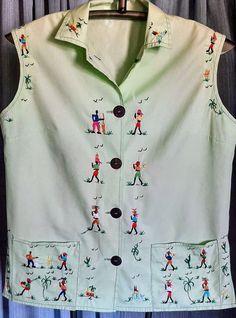 This is a hand embroidered top from Carlos and Haiti is in excellent condition.   The embroidery is in excellent condition,   Armpit to Armpit is 21 inches.  Length is  24 inches.  The only thing I noticed is inside facing has a wrinkle in it inside shirt.  Not visible (see pics)1 Vintage Green Embroidered Top, Green Button-up Top With Floral Embroidery, Green Cotton Tops With Machine Embroidery, Vintage Green Tops With Pockets, Green Vintage Tops With Pockets, Retro Green Top With Pockets, Green Embroidered Sleeveless Top, Green Sleeveless Embroidered Top, Green Sleeveless Tops With Pockets