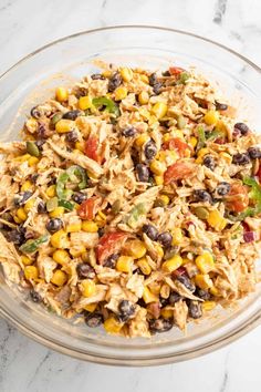 a glass bowl filled with mexican rice salad