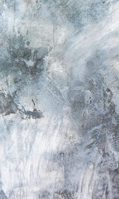 an abstract painting with white and grey colors on the surface is shown in this image