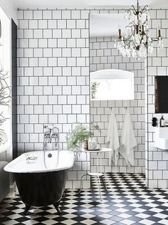 Why Black and White bathrooms are always a great choice Claw Foot Bathtub, Tiled Bathroom, Bathroom Chandelier, Black And White Bathroom, Industrial Style Home, Black White Bathrooms, White Bathroom Designs, White Bathroom Tiles, Victorian Bathroom