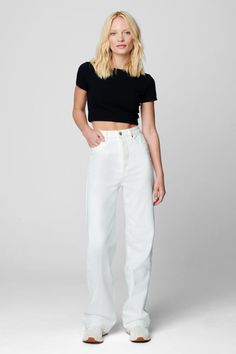 Your summer white jean is here! Boasting a loose wide leg fit, the See You Again Straight Leg Jean acts as the perfect companion to any crop top. Pair it with a cropped tee and sneakers or elevate your look with the Kaede crop Top and a pair of heels for your next summer outing! Bootcut Jeans Outfit, Sweatpants Fit, White Bootcut Jeans, England Summer, Sweater Jumpsuit, Jeans Fabric, Cute Boutiques, Summer White, See You Again