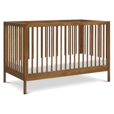 a wooden crib with white sheets on the bottom and side rails, against a white background