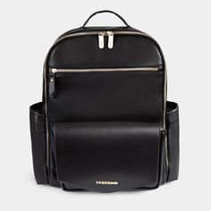 a black backpack with gold zippers on the front