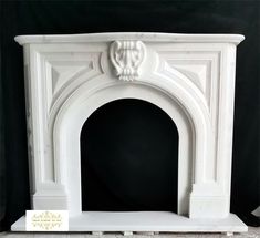 a white fireplace with a black background