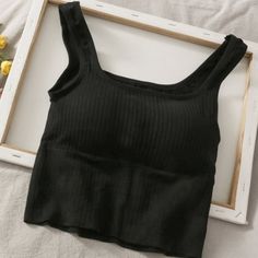 Brand New No Tags Color: Black Size: Xs / S Has Removable Padding Black Everyday Summer Tops, Black Summer Tops For Everyday, Casual Black Stretch Crop Top, Trendy Black Crop Top, Fitted Casual Black Crop Top, Trendy Black Seamless Tops, Black Seamless Summer Tops, Black Seamless Tops For Summer, Trendy Black Cotton Crop Top