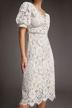 This lace crochet V-neckline midi dress will fill any of your little white dress needs, from your bridal shower to your after party. The textured lace overlay, accented with thick embroidery that outlines the lace’s blooms. Also features puff sleeves and delicate scalloped eyelash lace hem. The rhinestone trim and buttons adds an extra glitz and glam. No Stretch Medium Weight Size runs small,recommend one size up Fabric: 100% Polyester,Lining: 100% Polyester Model is 174cm/5'7" tall, 81cm/32" bust, 61cm/24" waist and 90cm/35" hip and wears a size S. Care Instruction: Hand Wash, Do not bleach, Dry flat in shade, Iron cool (max 110â„?, Dry clean, tetrachloroethylene(PCE) only.Please note: The images represent actual product though color of the image and product may slightly differ. This item Delicate Lace Midi Dress For Party, Tea Length Lace Dress For Formal Occasions, Formal Lace Midi Dress With Lace Sleeves, Formal Tea Length Lace Dress, Fitted Scalloped Lace Tea-length Dresses, Fitted Tea Length Scalloped Lace Dresses, Elegant Lace Midi Dress With Scalloped Lace, Fitted Tea Length Dress With Scalloped Lace, Elegant Lace Midi Dress With Delicate Lace