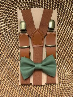 a bow tie and suspenders sitting on top of a table