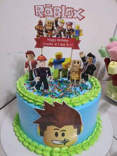 a birthday cake with lego figures on it