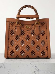 GUCCI Diana debossed laser-cut leather tote Gucci Diana Bag, Gucci Diana, Gucci Print, Small Water Bottle, Gucci Mini, Laser Cut Leather, Small Tote Bag, Gucci Shoulder Bag, Mini Tote Bag