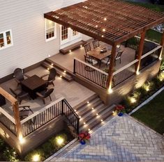 an outdoor deck with lights on it