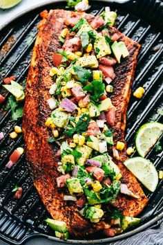 grilled salmon with corn, avocado and cilantro salsa on the grill